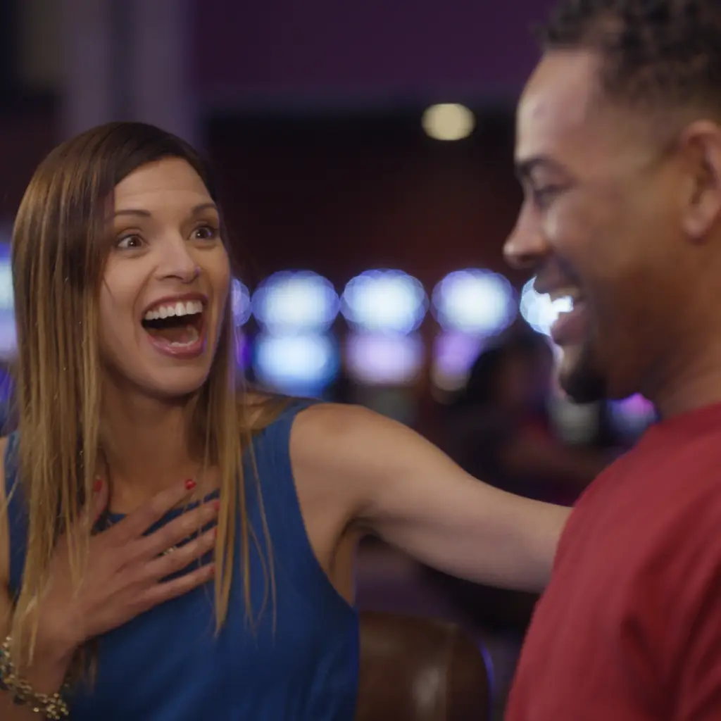 Couple enjoying the slot machines