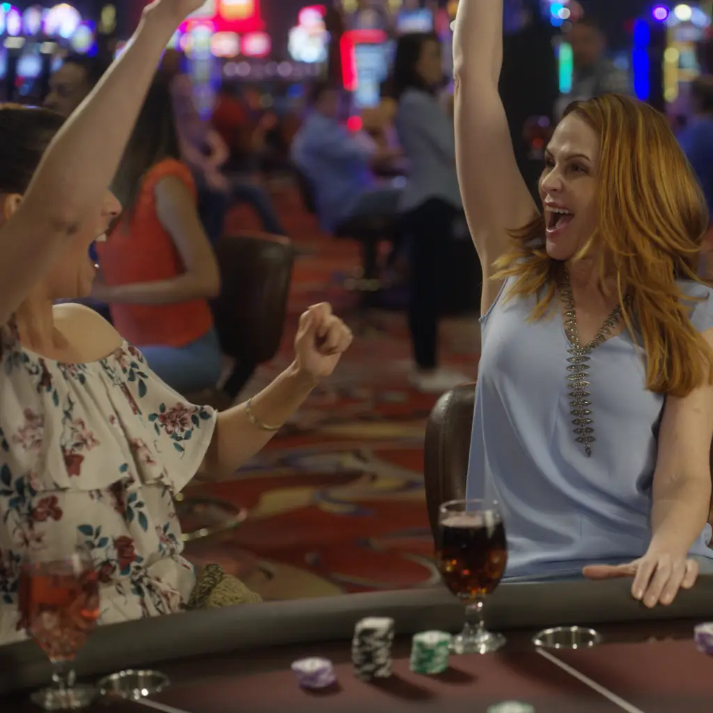 Two women celebrating at Table Games